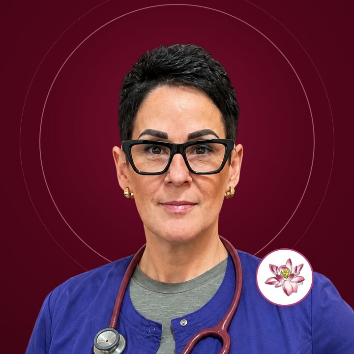 Dawne Ilnisky, RN, smiling in navy scrubs with a stethoscope